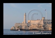 Morro lighthouse at the harbor mouth in havana, late afternoon.