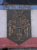 Wyoming state seal mosaic at the Hoover Dam; Colorado River at Lake Mead.
