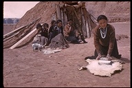Navajo girl grinding corn in Monument Valley, Navajo Indian Reservation, Arizona, USA