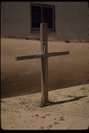 A penitent cross in patio of Santa Ninos Church near Sanctuario