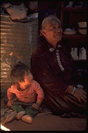Navajo grandmother and baby in hogan