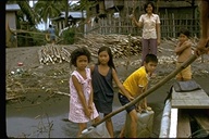 Philippine children carrying water