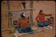 Navajo Native American weaver with daugher-in-law and children