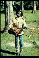 A muscian playing a obokano or bowl lyre in Kenya, Africa