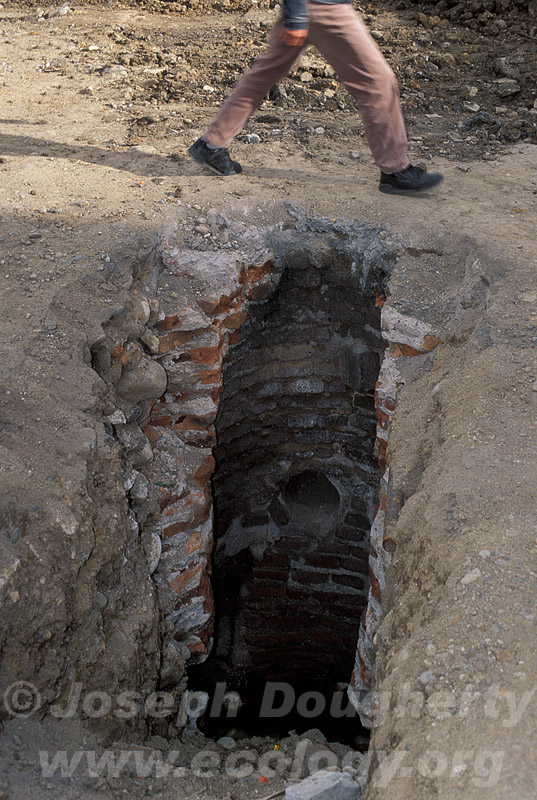 Working to repair the aging sewer system beneath the cobbled streets of Cuenca (Ecuador).