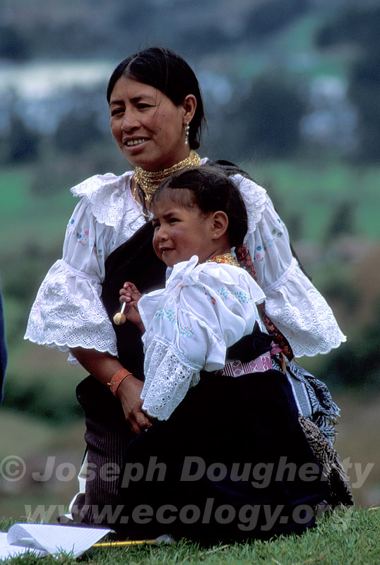 Quechua Indian woman and child in traditional dresses (Otovalo, Ecuador).