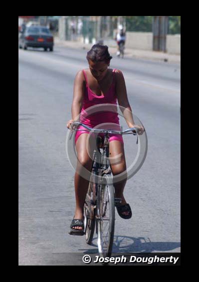 Girl on bicycle in Havana