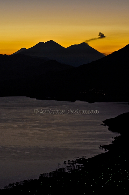 View from the indian nose, Lago Atitlan, on Lake and smoking volcano Fuego