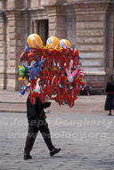 Balloon vendor in park in colonial Andea city of Cuenca.