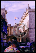 Cuban flag over old town; Havana, Cuba