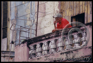 man on balcony; Havana, Cuba