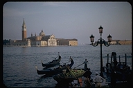 View of gondoliers and Isla San Giorgio, Venice, Italy