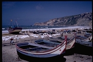 Fishing boats and laundry on beach at Nazare, Portugal
