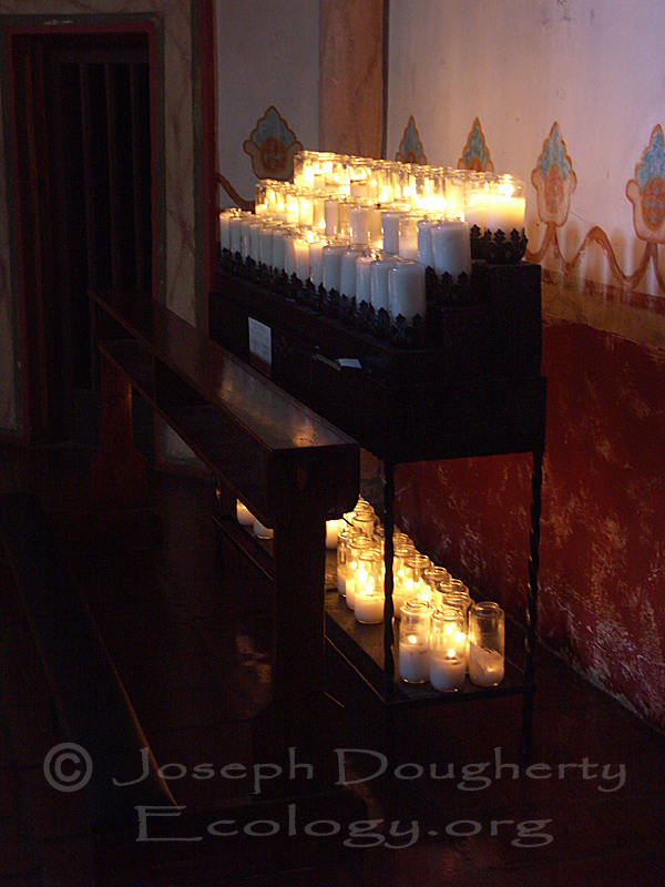 Cathedral interior with prayer candles, at the California Mission San Luis Rey de Francia