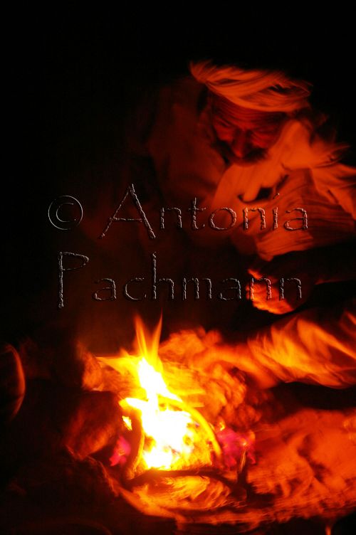 indian man on campfire in thar-desert indian man on campfire in thar-desert