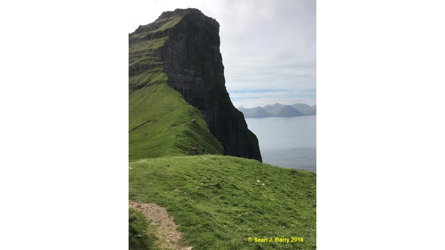 Basalt sea cliff south of Kallur Lighthouse, Kalsoy, Faroe Islands