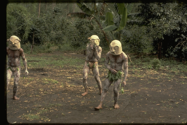 Papua New Guinea men in paint and masks