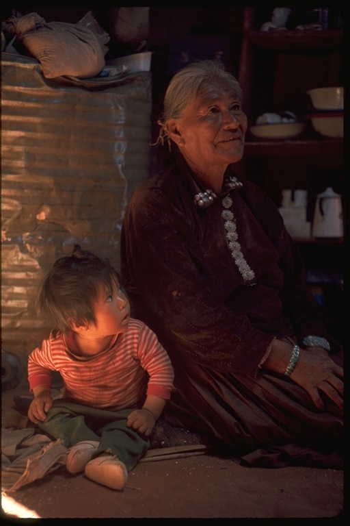 Navajo grandmother and baby in hogan
