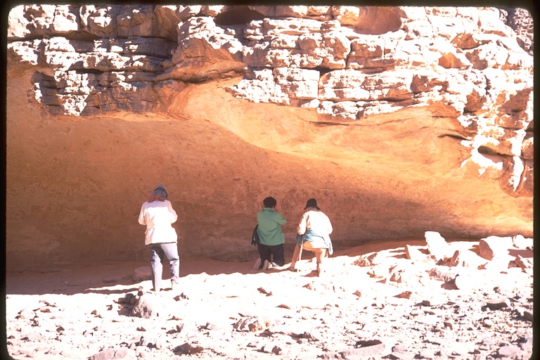 Examining rock paintings at Sefar Examining rock paintings at Sefar