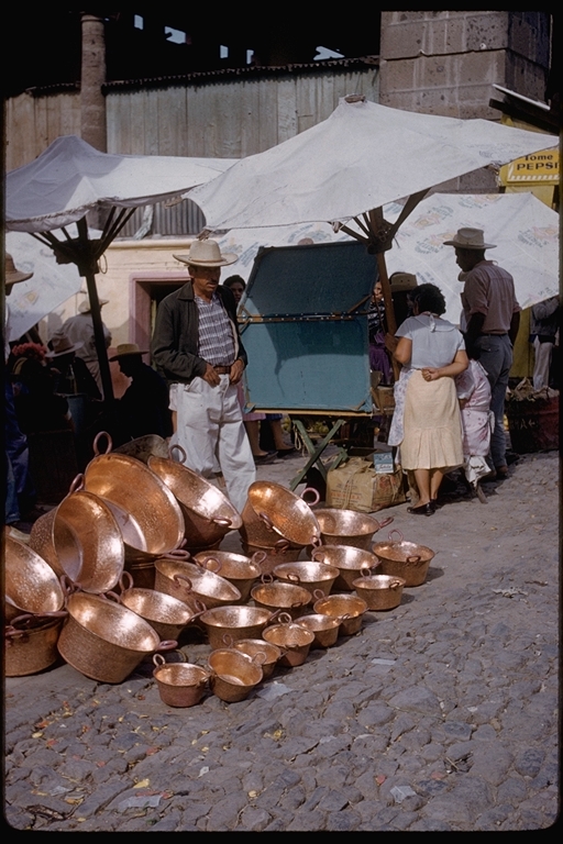 Market with copper pot vendor, Mexico