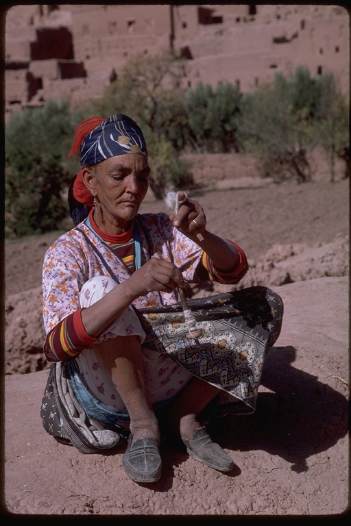 Berber woman spinning wool in Ouarzazate, Morocco