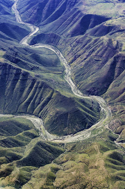 Geologic features of Baja California Norte from an airplane showing erosion, valley